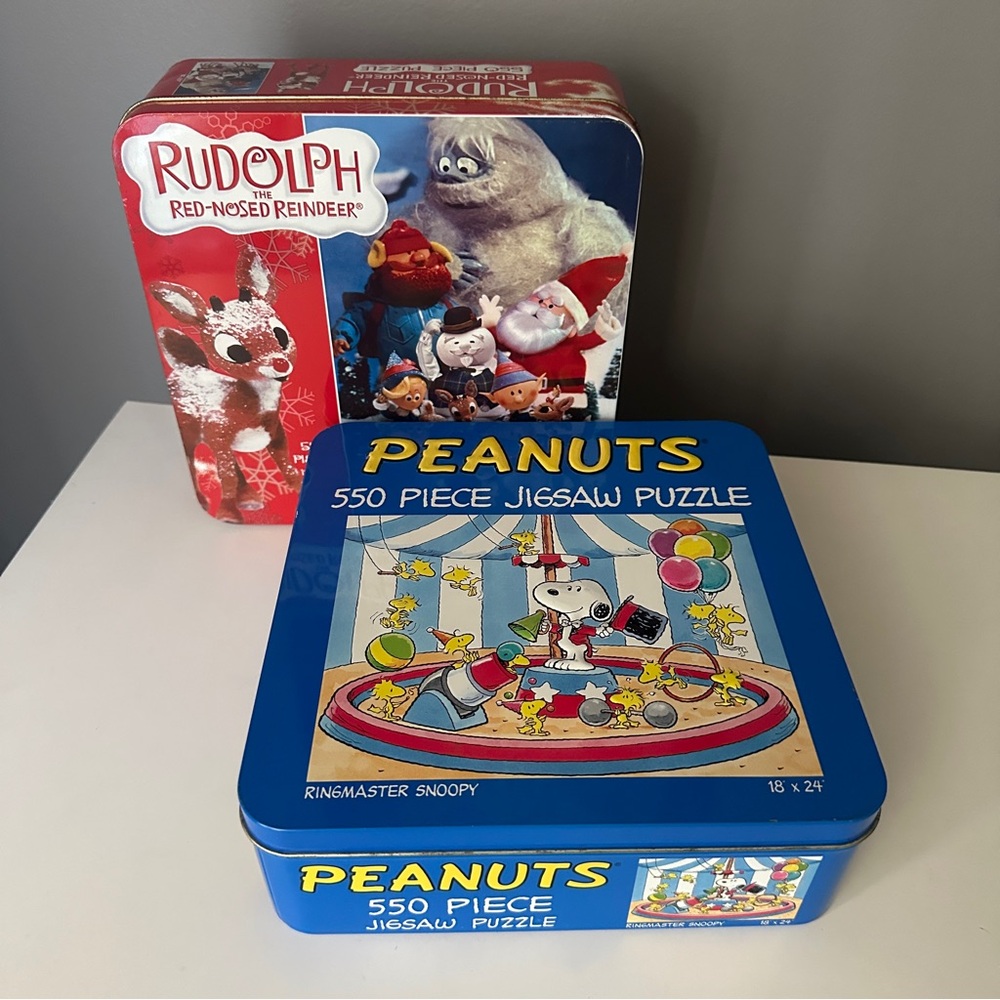 Set of 2 puzzles in tin boxes—Peanuts and Rudolph the Red Nosed Reindeer